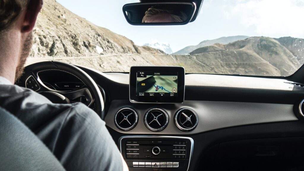 A man driving through a rocky place