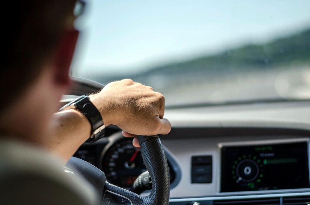 A man driving (view from the back)