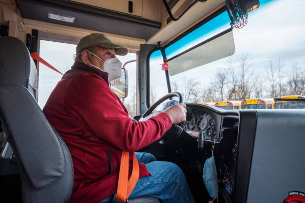 A bus driver wearing a mask