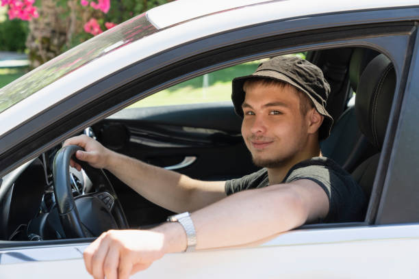 A man driving and smiling